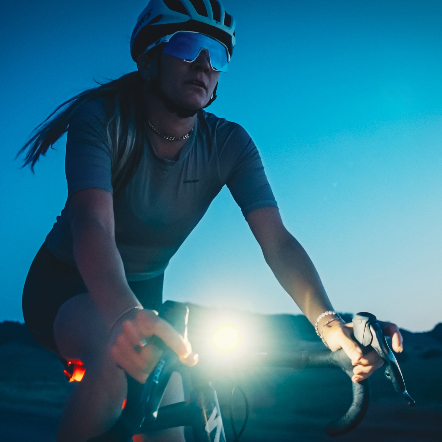 Road cyclist at night with Lezyne Radar React StVZO System — delivering exceptional visibility and radar-based safety alerts.
