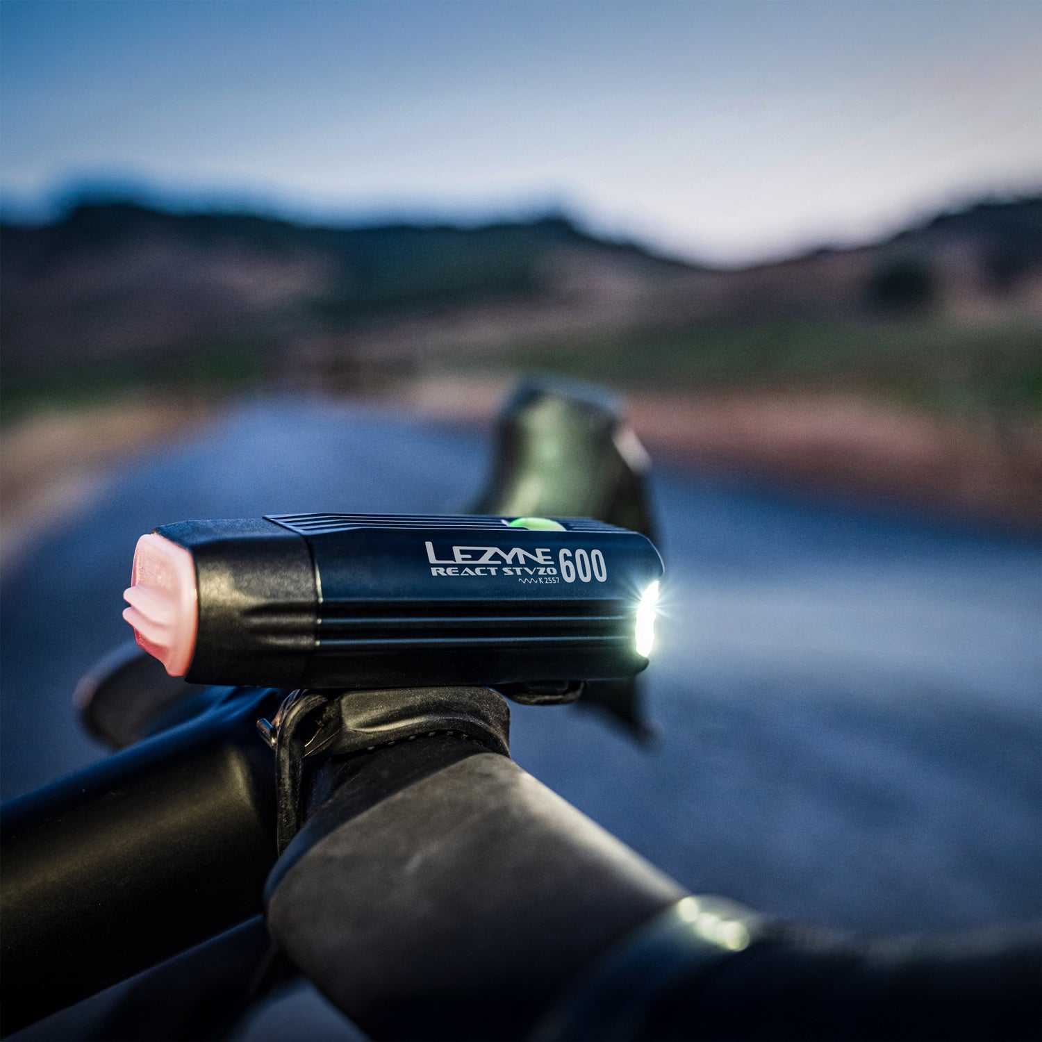 Lezyne React StVZO Front on remote road ride, warning riders with vehicle alerts when cars approach from behind.