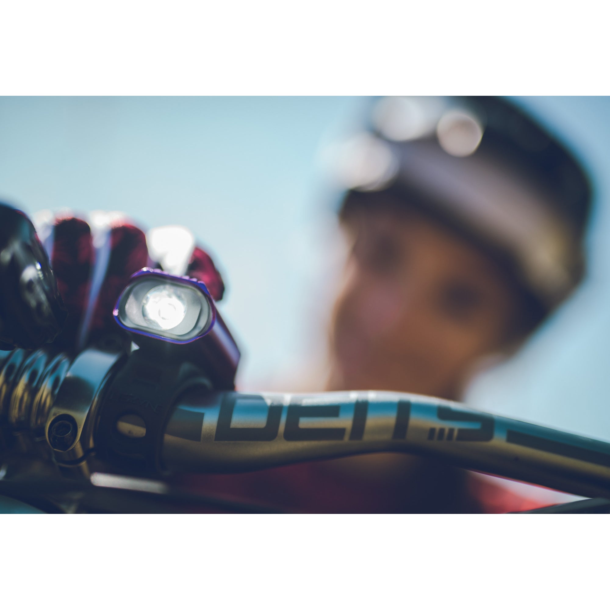 Purple Hecto Drive 500XL front bike light on a mountain bike