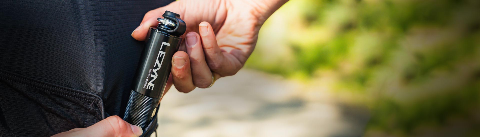 Close-up of Lezyne hand pump for mountain bikes, built for quick tire inflation on rugged and challenging mtb trails.
