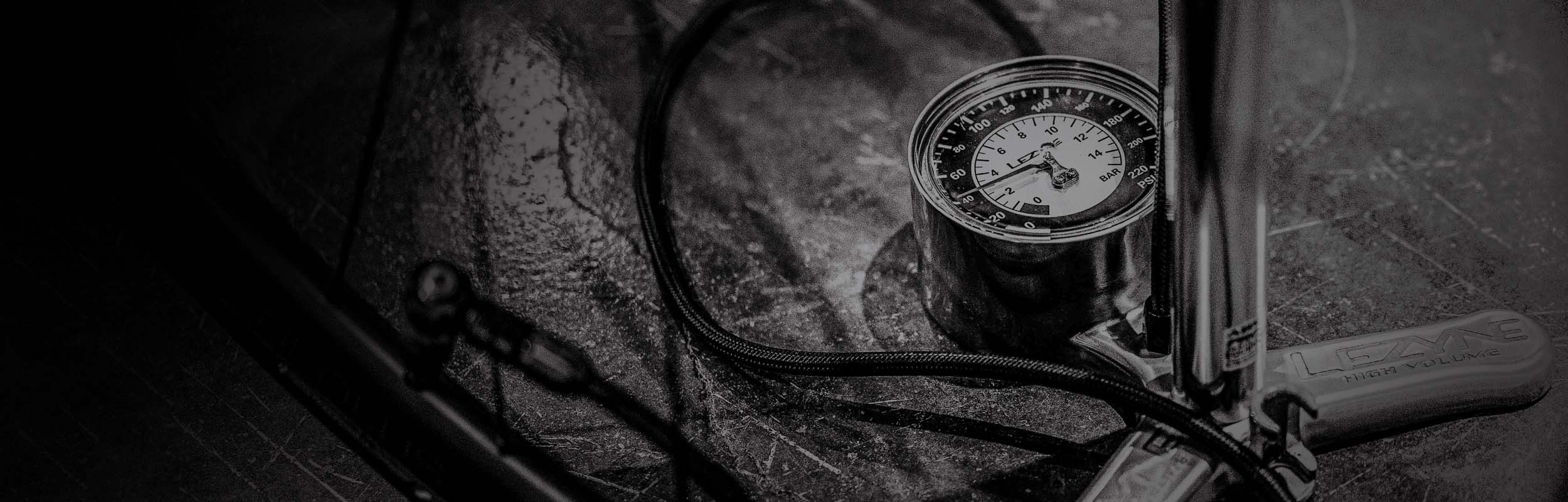 Close-up of Lezyne floor pump for gravel bikes with gauge, designed for precise tire inflation.