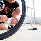 Lezyne Alloy Floor Drive 3.5 Presta Pro Chuck connected to a bicycle tire valve for accurate inflation