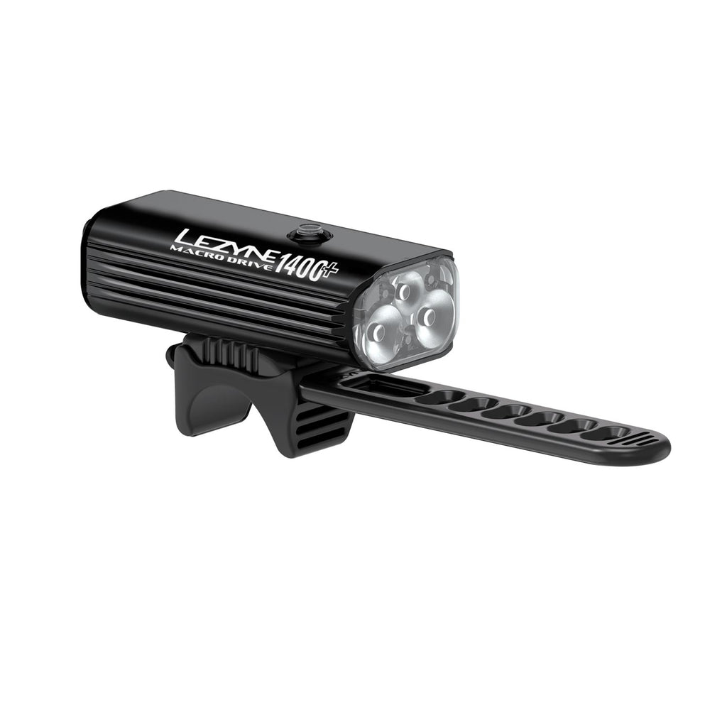 Profile view of a road bike featuring MACRO DRIVE 1400+ LED front light and bright rear bike light, the perfect combo for maximum safety for night cycling.