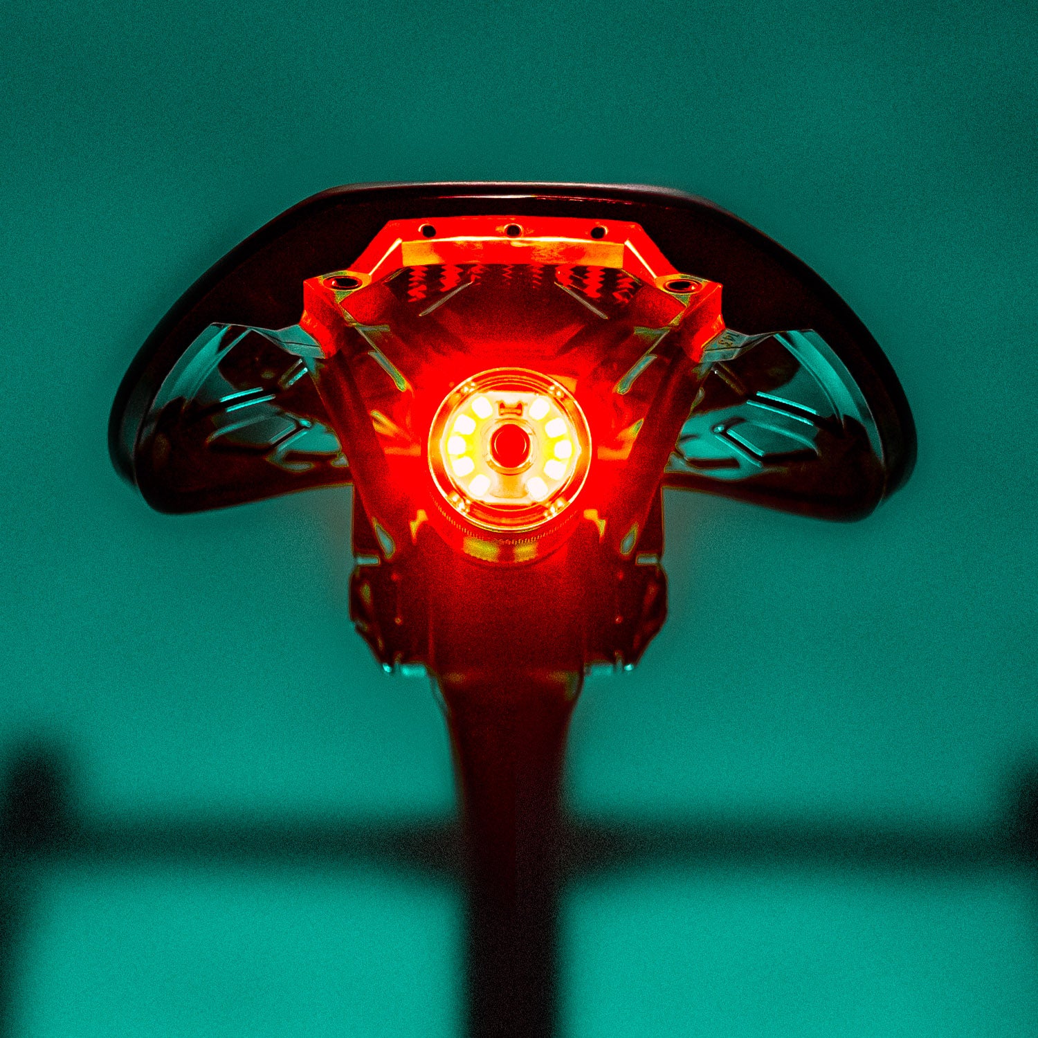 SADDLE Ai ALERT 250 REAR LED bike light mounted on road bike saddle, emitting a powerful red brake light for high safety standards.