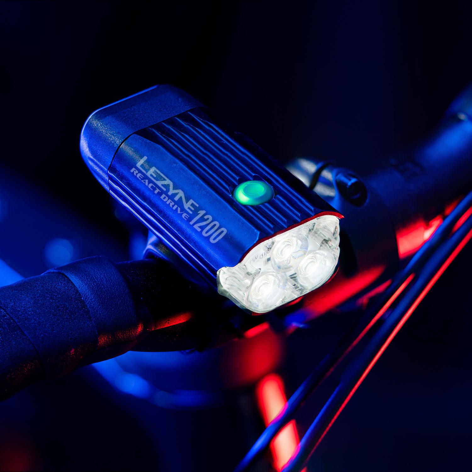 Lezyne React Drive LED front bike light studio close-up; engineered lens and optics detail for clear, efficient illumination.