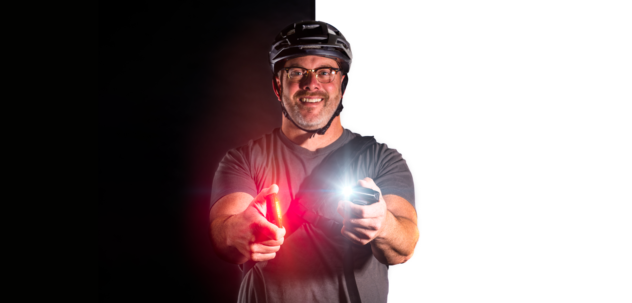 Commuter cyclist holding a front and rear light