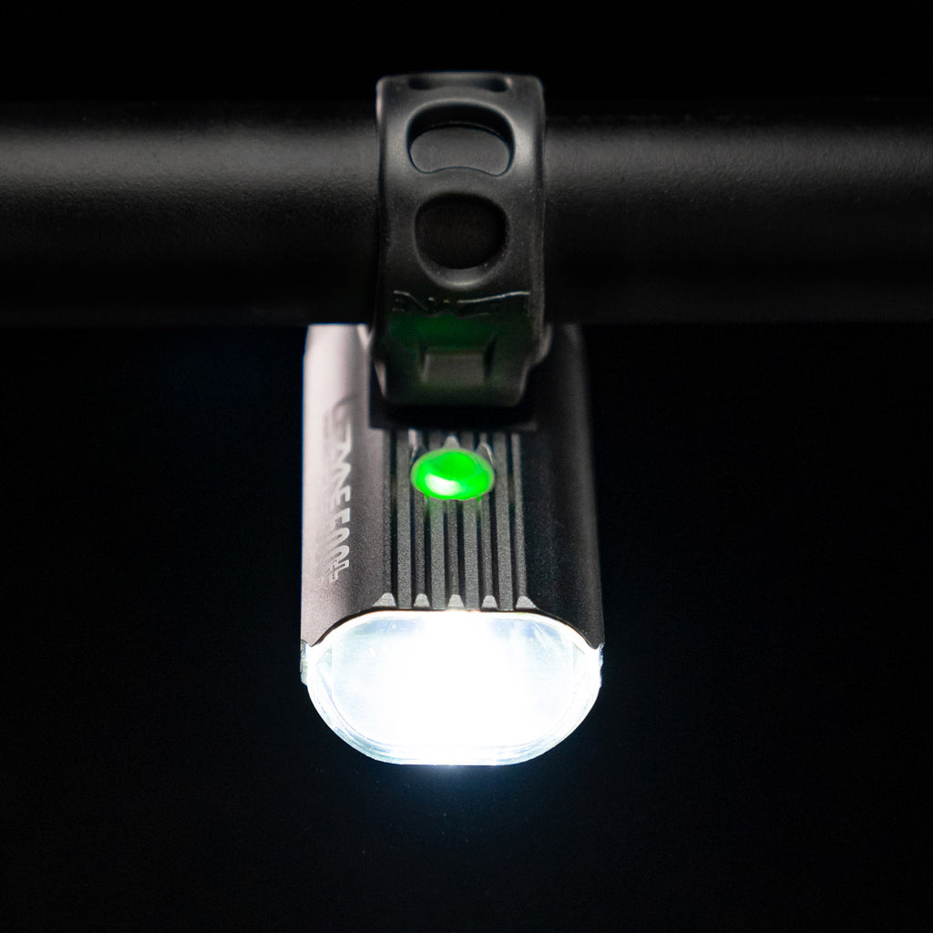 Bird's-eye view of the Lezyne Macro StVZO 500+ Reverse headlight, mounted upside down on the handlebars, with a small green circular power light on top.