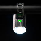 Bird's-eye view of the Lezyne Macro StVZO 500+ Reverse headlight, mounted upside down on the handlebars, with a small green circular power light on top.