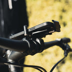 CNC Phone Mount on a road bike, demonstrating compact size and precision fit for modern smartphones.