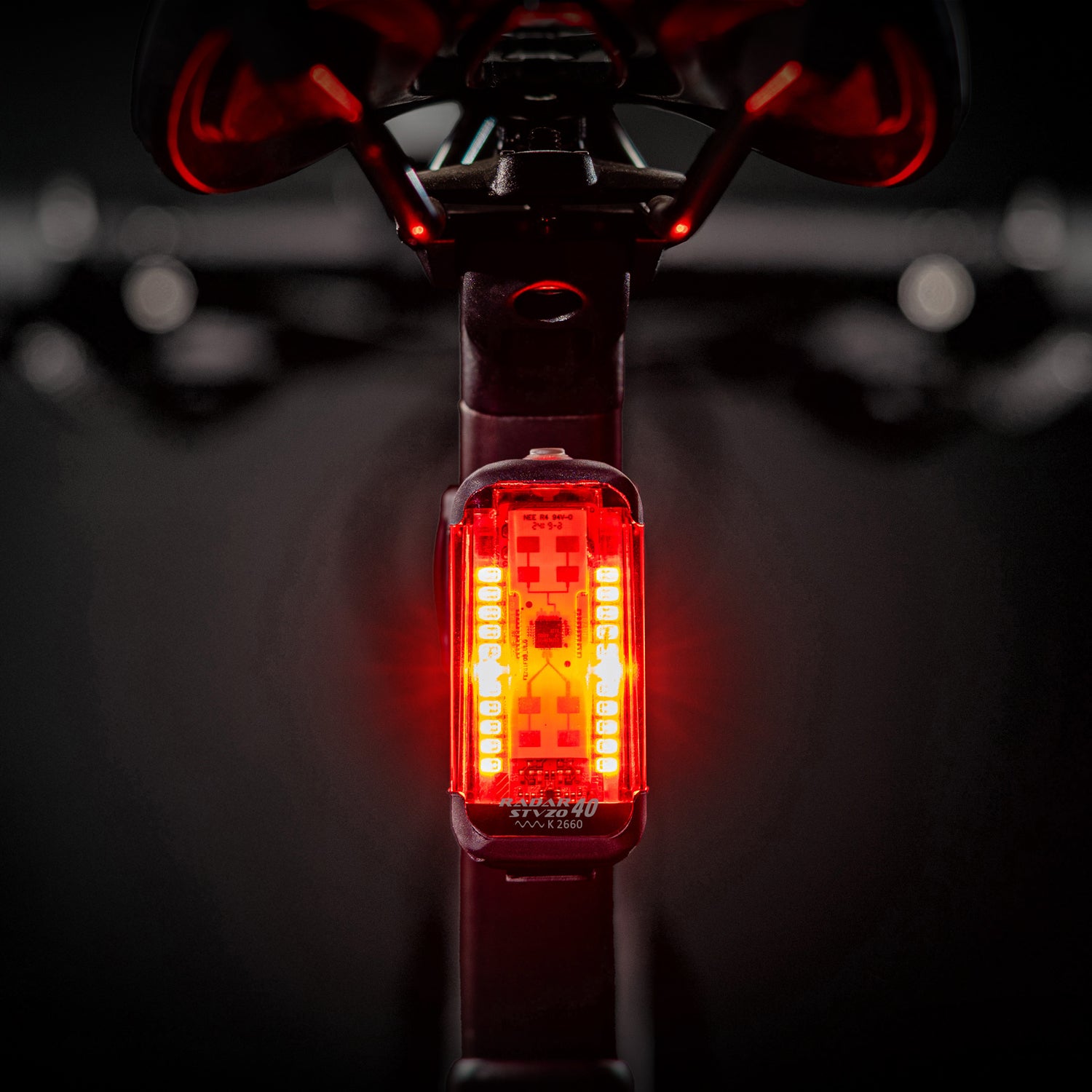 Lezyne Radar StVZO Rear glowing brightly on a road bike, providing radar-based vehicle alerts for safety.