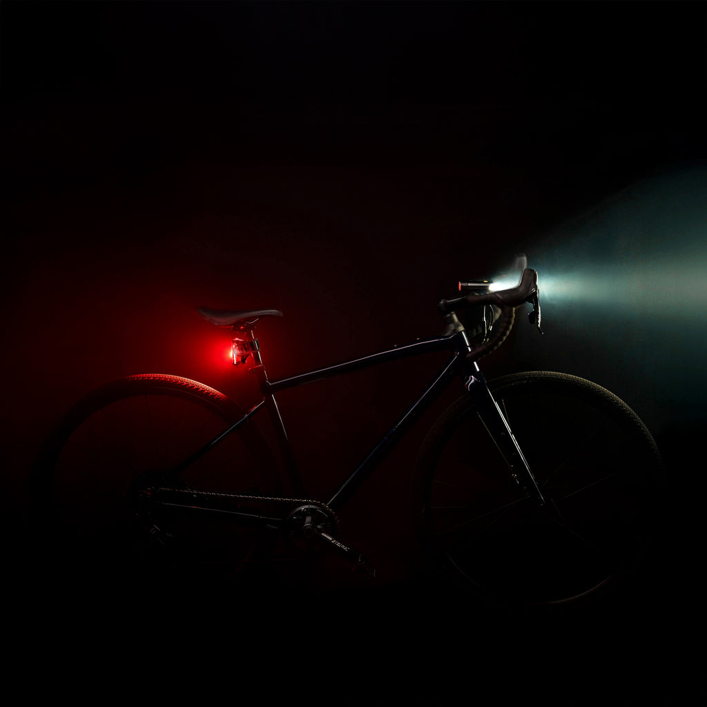 Lezyne Radar React System on gravel bike side view; front and rear lights mounted, low profile fit on seatpost and handlebar.
