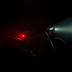 Lezyne Radar React System on gravel bike side view; front and rear lights mounted, low profile fit on seatpost and handlebar.