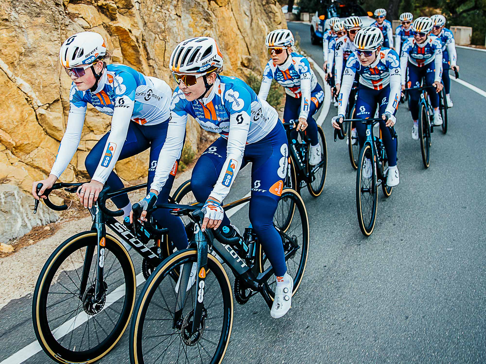 Group of professional Female riders on a hilly road