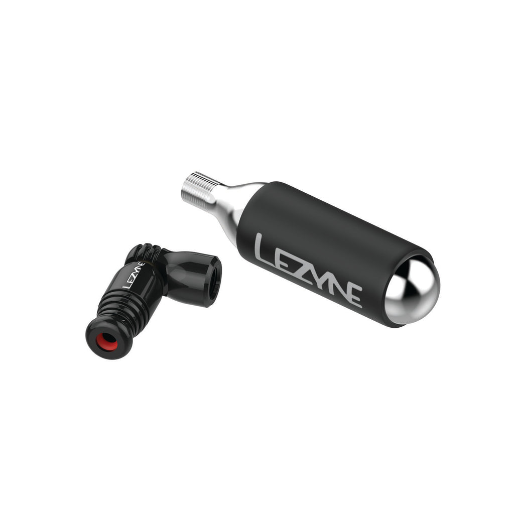 Black Trigger Speed Drive CO2 inflator head and 16g cartridge separated, compact design with trigger valve and Presta fit.