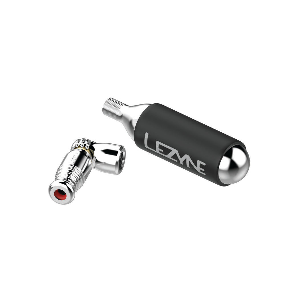 Disassembled silver Trigger Speed Drive CO2 inflator with cartridge, Presta valve fit and precision trigger control.