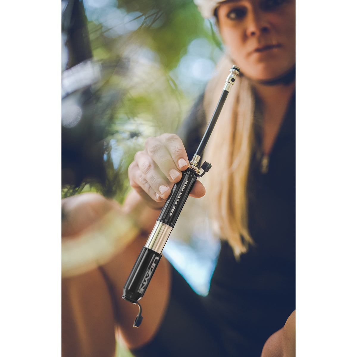 Pressure Drive bike hand pump highlighting portability and lightweight design for road cyclists.
